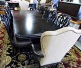 10 ft. long x 4 ft. wide dining table + 10 chairs, leather seats on all with 2 upholstered arm chairs. 