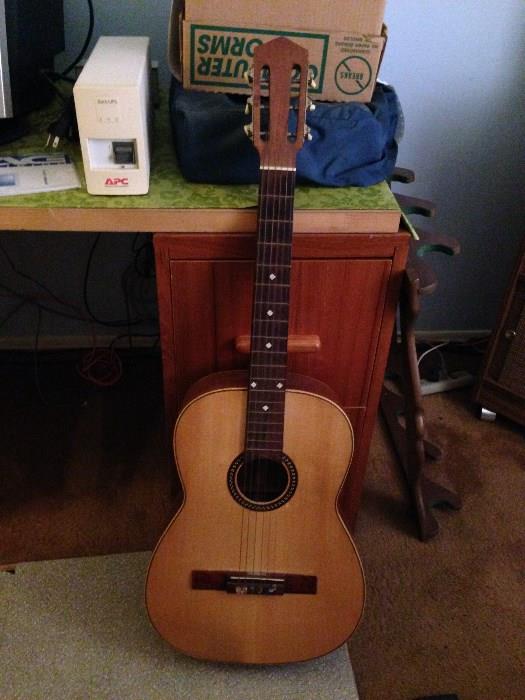 Guitar,  also selling a ukulele and harmonicas