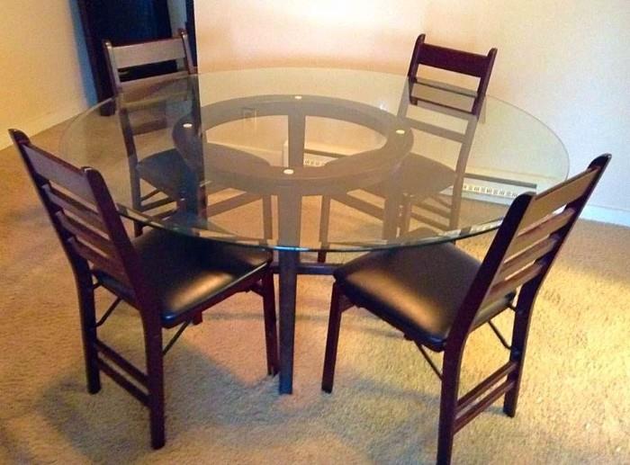 Pottery barn Contemporary Glass and Wood dining room table. Chairs are nice folding chairs; perfect for a small space.