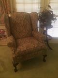 Another wing back chairs; antique stool used as a plant stand