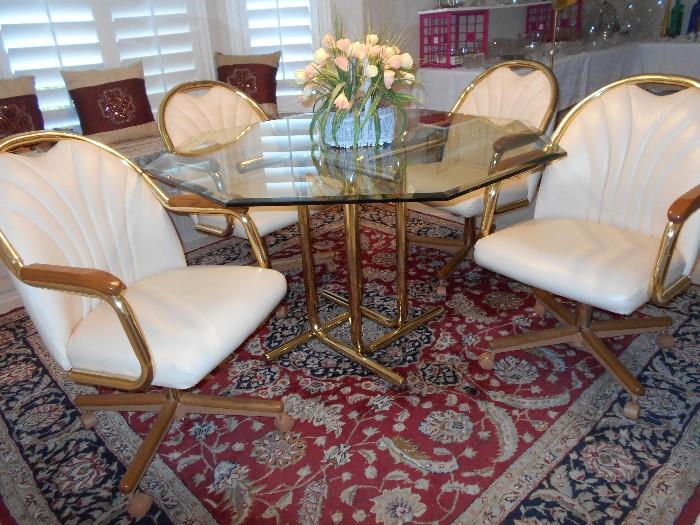 Dinette set - octagonal glass top on brass tone base and four chairs