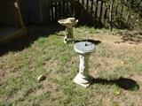 Cement bird bath and sundial.