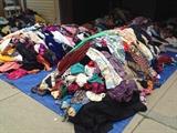 piles of women vintage/contemporary clothing