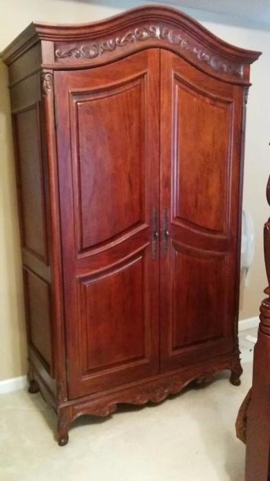 Nicely carved French armoire, manufactured by Hamilton Heritage Co., in Guatemala. I know they make belts down there, there's coffee, revolution, social unrest AND they make furniture too!                              Who knew!