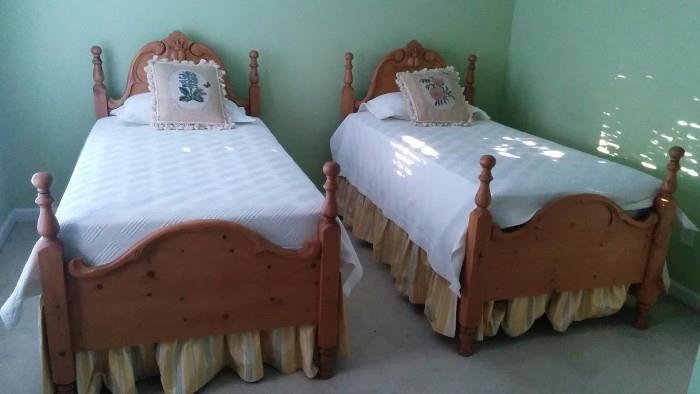The CUTEST pair of hand-carved heart pine twin beds you'll see! Custom made dust ruffles and hand embroidered/tasseled pillows. If your marriage has degraded to the point that you sleep in separate beds, take the tassels off the pillows and use them imaginatively to put that special spark back into the bedroom!