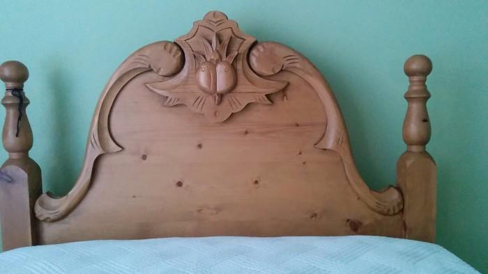 Close-up shot of one of the heart pine twin bed headboards