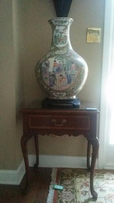 LARGE porcelain Asian Vase, on wooden stand; the other of the pair of glass-topped mahogany side tables, by Hickory Furniture Co.