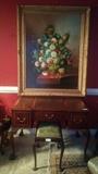 Beautiful original, artist signed oil on board floral still life. Antique French carved mahogany ball/claw foot desk, w/tooled leather inserts.
