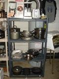 Good quality cookware. Cast iron on the bottom shelf.