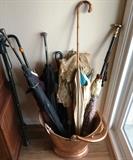 Vintage umbrellas in brass coal scuttle