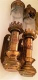 Antique wall sconces on has broken glass