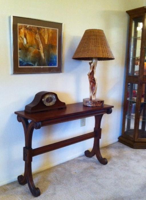 Wood console table, mantel clock, Diamond Willow Tree hand-carved lamp, curio with lights (on the far right). The Rosemary Meyer "Antelope Canyon" watercolor painting above won 1st prize at an art festival.