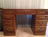 7-drawer dark wood desk