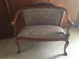 Carved wood antique love seat