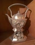 Meriden Silver Co. tea pot on a tilting and heating stand. Beautiful!