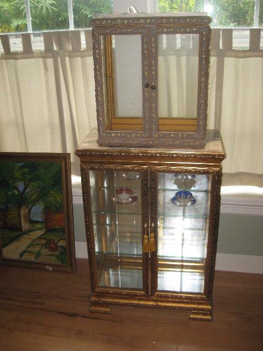 antique florentine style curio cabinet with top display and both have marble tops