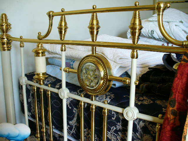 White iron bed with canopy