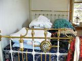 White iron bed with canopy