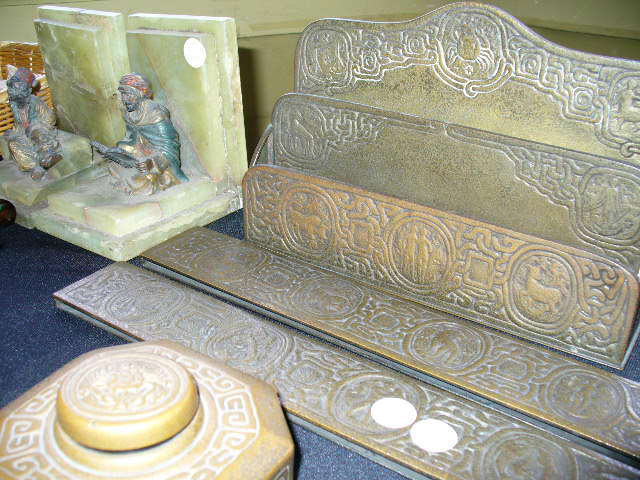 Tiffany Studios 'Zodiac' partial desk set to include the inkwell with original glass liner, stationary holder and pair of writing pad rails