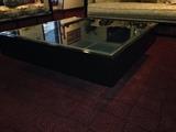 Beautiful glass top coffee table with black base