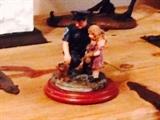 Policeman with Child Figurine