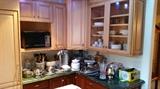 An overall view of half of the kitchen and kitchenware.  Good quality items are everywhere.