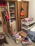 A whole lot more of things than you can see in this picture, there are a lot of quality handmade table cloth for all holidays and all seasons in that closet. A solid wood baby changing station.