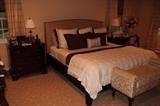 Master Bedroom includes large storage Armoire, King Sleigh Bed, Baker side tables