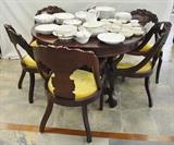 Highly carved Victorian style dining table & chairs