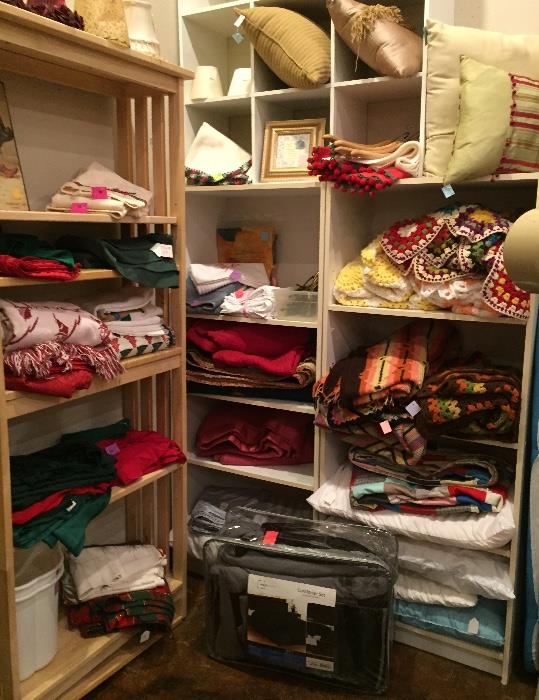 Linens -- afghans, crochet, pillows, comforter set, tablecloths.