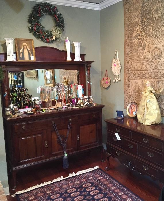 Mahogany sideboard with mirrored back filled with costume jewelry, Lane elevated cedar chest, tapestry and Oriental rug.
