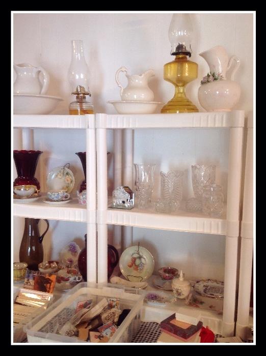 Oil lamps, costume jewelry, tea cups, pitcher and basins