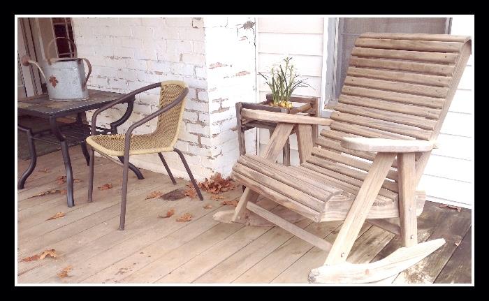 Vintage adirondack rocker and table; we have other things not pictured- picnic table, cherub fountain, girl fountain, flower pots, old wire baskets of every kind, chimes. 