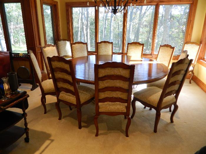 With thanksgiving coming you have the rare opportunity to purchase 8' round high end table and 12 chairs to serve your thanksgiving feast 