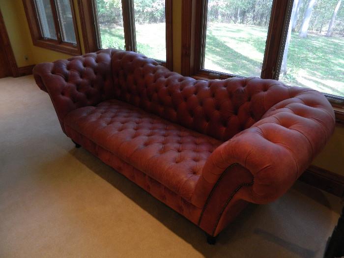 Leather tufted couch. This piece wouldn't be in the sale if had a place to put it, very unique. 