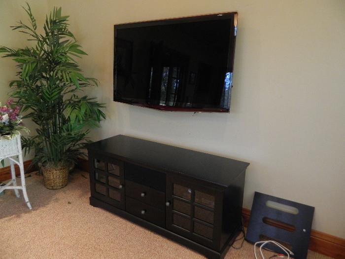 Samsung Television with wall mount or also have the base . Also available is the entertainment center.