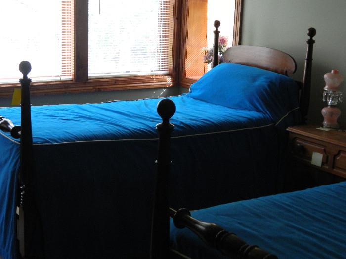 Pair of twin beds with mattresses