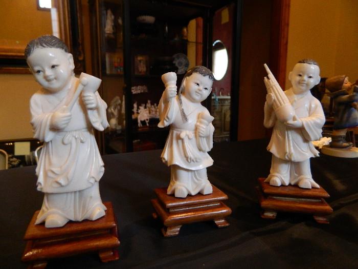 Hand carved Ivory Colored Asian figurines  each one measures  2 1/2 inches wide x 4 1/2 tall including base item 0121 