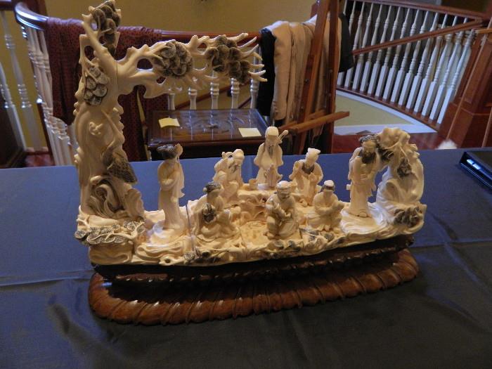 Very intricate Ivory colored Asian carving attention detail is amazing                                                        Measures 18 inches x 10 inches Item 0127