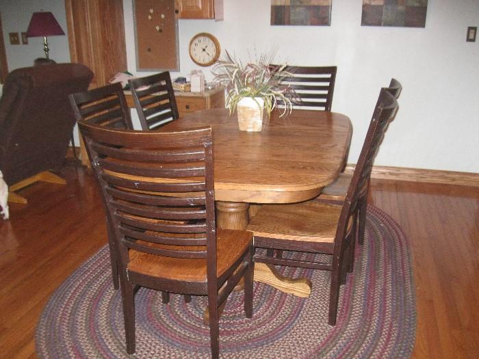 Oak table with leaf and six chairs - $350