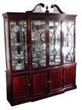 STICKLEY GEORGIAN MAHOGANY BREAKFRONT, PIERCED FRETWORK, BANDED CROTCH MAHOGANY DOORS, GLASS SHELVES, LIGHTED INTERIOR, 