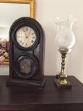 Antique clock (as-is) and 1 of a pair of lamps.