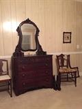 Victorian mahogany chest and a pair of chairs like the one pictured on the right of the chest.