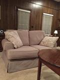 Oversized neutral fabric covered loveseat in good condition.