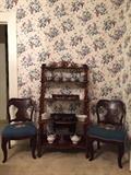 Nice Victorian etagere and pair of antique chairs with needlepoint. Collection of ceramics.