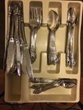 Large set of stainless flatware.