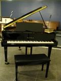 Gorgeous Henry Miller baby grand piano with stool.