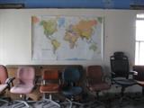 Large map of the earth and chairs