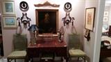 Antique original oil painting of a copy of Titian, sporadic collection of black tole/gold plates, table lamp, pair of Italian sconces, Art Deco 2-light desk lamp, pair of French green side chairs, GORGEOUS antique mahogany/leather insert desk, with ball & claw feet