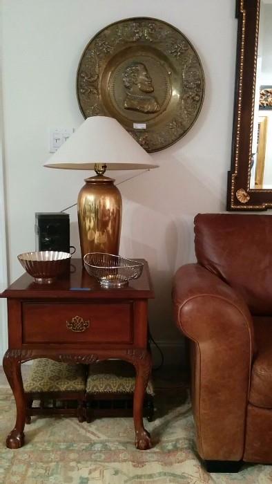 1960's French Provincial 1-drawer side table, one of a pair of gold porcelain table lamps, one of a pair of antique English brass chargers 